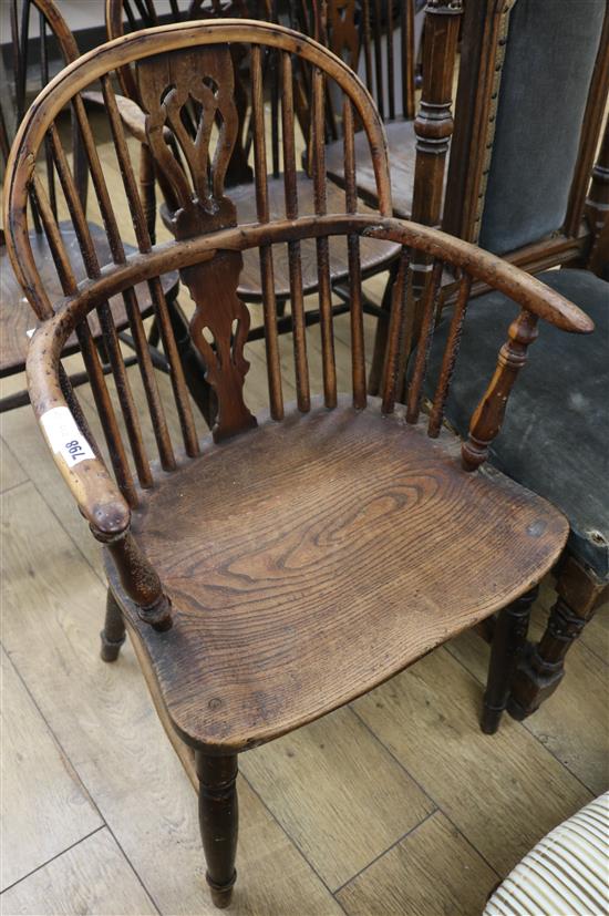 An early 19th century Windsor yew, elm and ash elbow chair